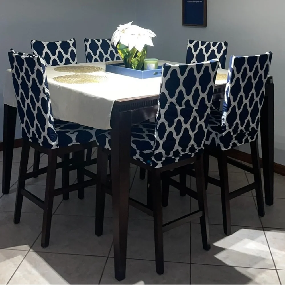 6 chair covers, white and blue with designs.